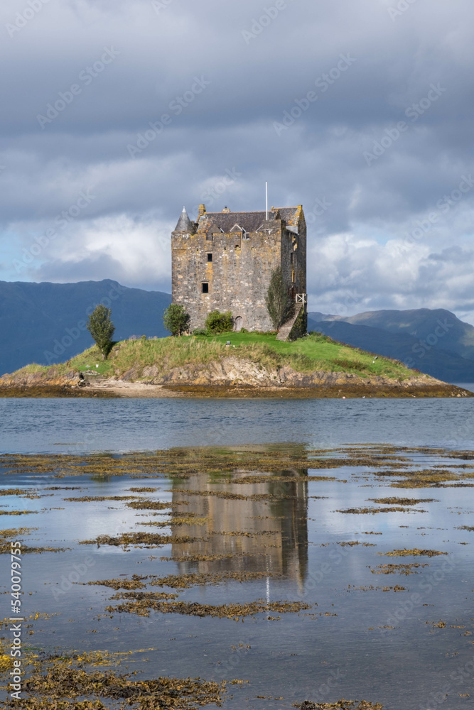 Castle Stalker on loch linnhe, coastline of argyll. A four-storey tower house/keep on a loch on a tidal islet. A small castle on a tiny island in Sotland. 