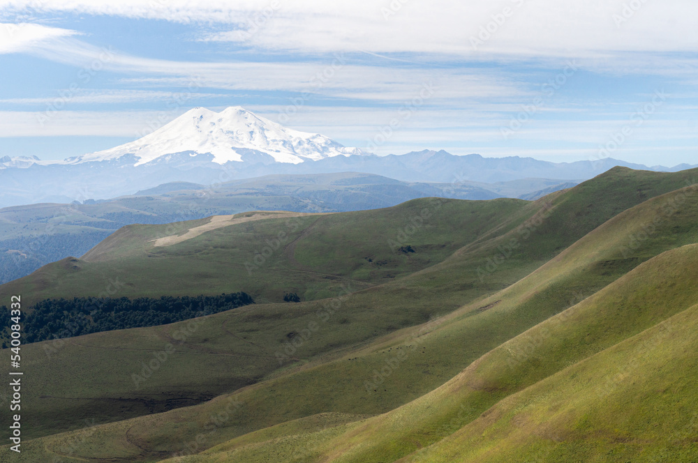 Fototapeta premium Mount Elbrus in summer. hills and meadows of Caucasus