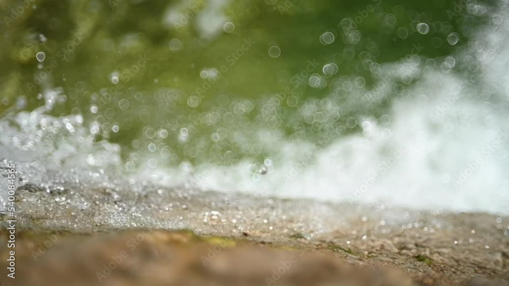 Bokeh from water falling into a pool (slow motion) Bokeh from water falling into a pool (slow motion)