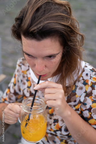 girl drinking orange juice 