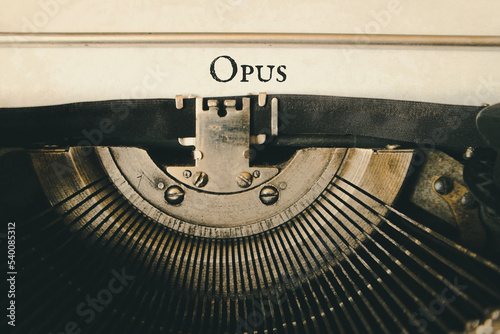 The name Opus is printed on the sheet with an old typewriter.