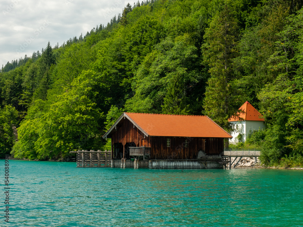 Naklejka premium Wooden dock houses on the lake with typical wooden pier,