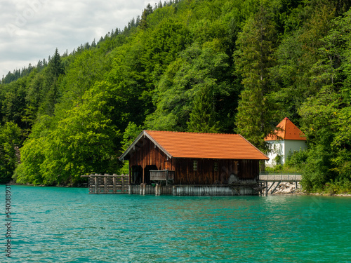 Wooden dock houses on the lake with typical wooden pier,