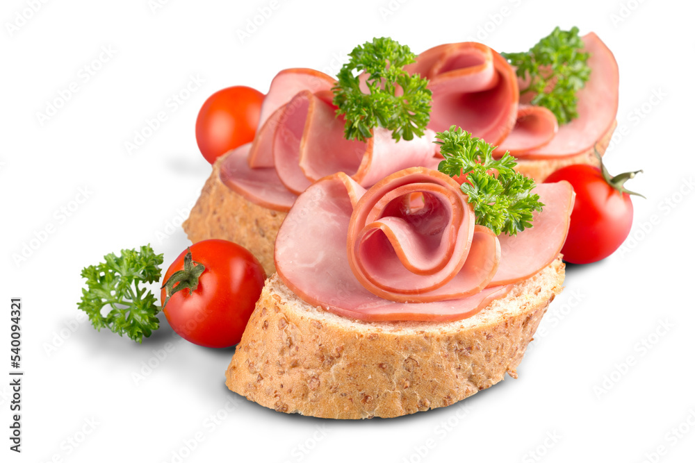Jamon. Slices of Bread with Spanish Serrano Ham Served as Tapas. Cured ham, spanish appetizer. Prosciutto isolated on white background