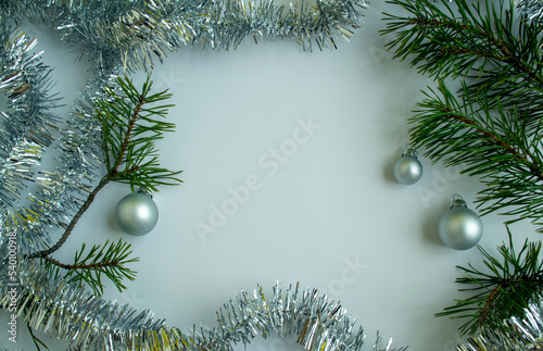 Christmas tree branches, tinsel and Christmas balls. photo