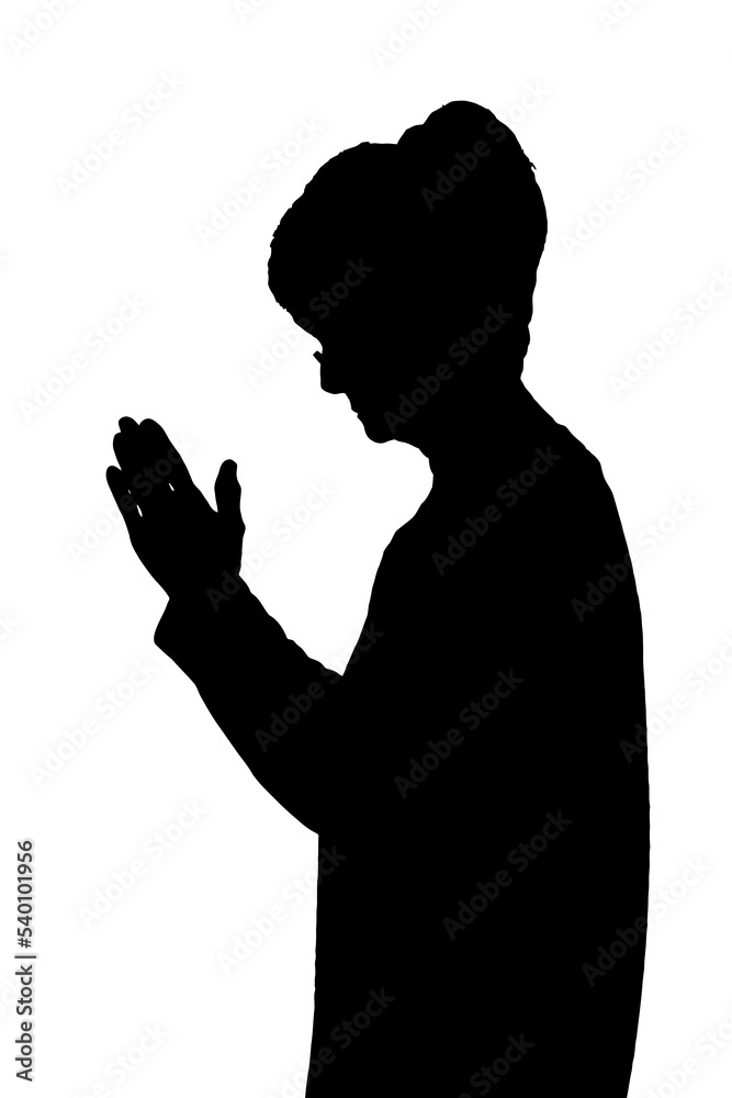 Side profile portrait silhouette of elderly lady standing praying
