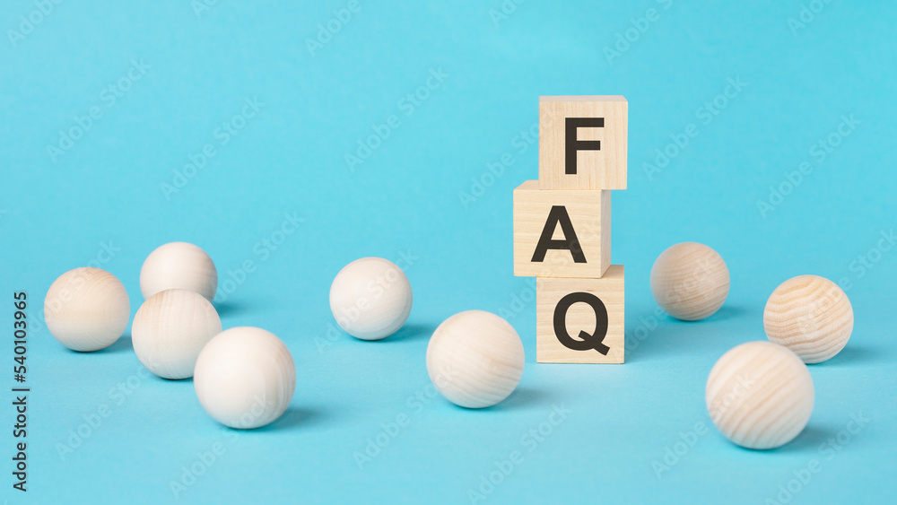 faq - short for exchange to exchange - on a wooden cubes on a blue background faq - short for exchange to exchange - on a wooden cubes on a blue background