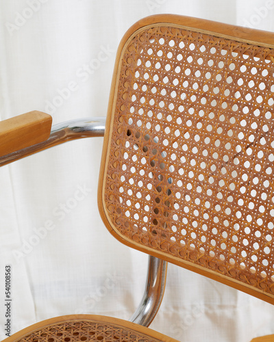 Vintage mid-century modern wooden chrome and cane Cantilever chair backrest detail. photo