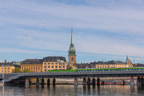 The commuting train bridge Getingmidjan passing the old town islands waterfront an autumn day in Stockholm