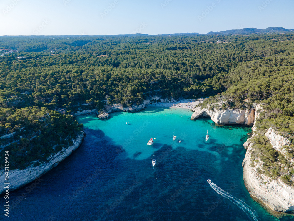 aerial view of the Menorcan coastline showing boats enjoying the summer