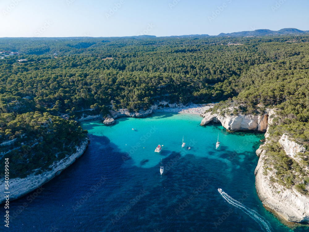Obraz premium aerial view of the Menorcan coastline showing boats enjoying the summer