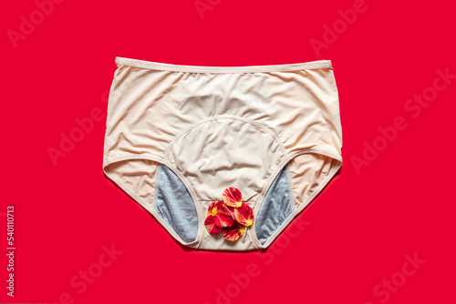 Reusable Period Underwear with rose flower petals on red background. Absorbent and Affordable Period panties to absorb menstrual fluid