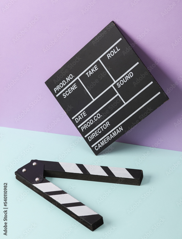 Naklejka premium Creative retro 80s layout with movie clapperboard on pastel background. Conceptual pop. Minimal still life