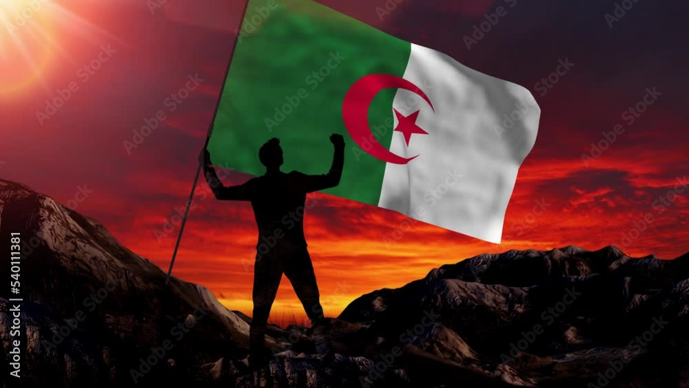 Algeria flag on mountain waving in slow motion at a bright overlook and sun light background - business, success, leadership, achievement and people concept