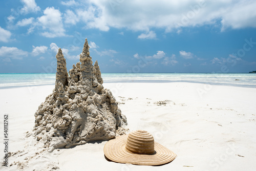 Fototapeta Naklejka Na Ścianę i Meble -  Sand castle on tropical white sand beach in Maldives. Holiday concept with sandcastle on sand castle on seaside.