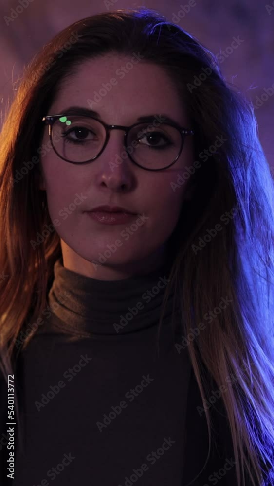 Beauty and fashion shot of a young pretty woman - slow motion shot - Vertical video Beauty and fashion shot of a young pretty woman - slow motion shot - Vertical video