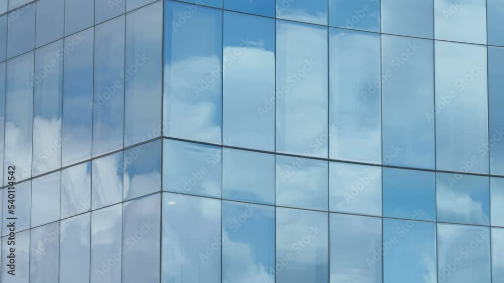The glass window of the building in the city with the reflection of the sky in Estonia