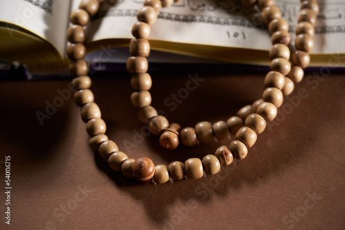 holy book koran and prayer beads