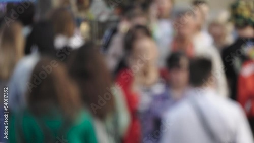 Wallpaper Mural an unrecognizable crowd of people walks through the city, a pedestrian walks Torontodigital.ca