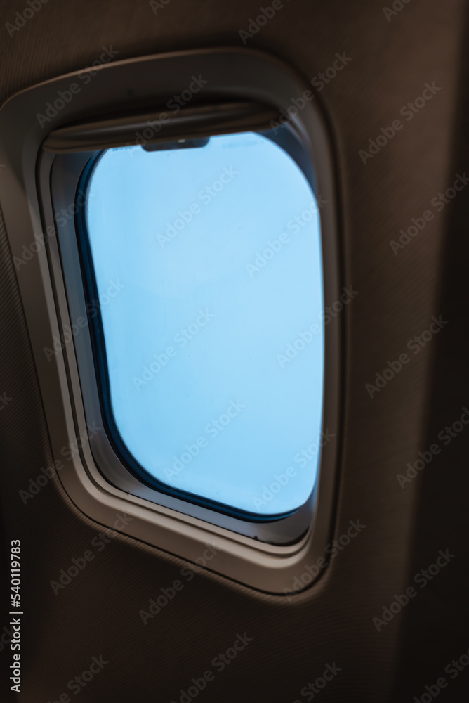 passenger plane window without people with blue sky passenger plane window without people with blue sky