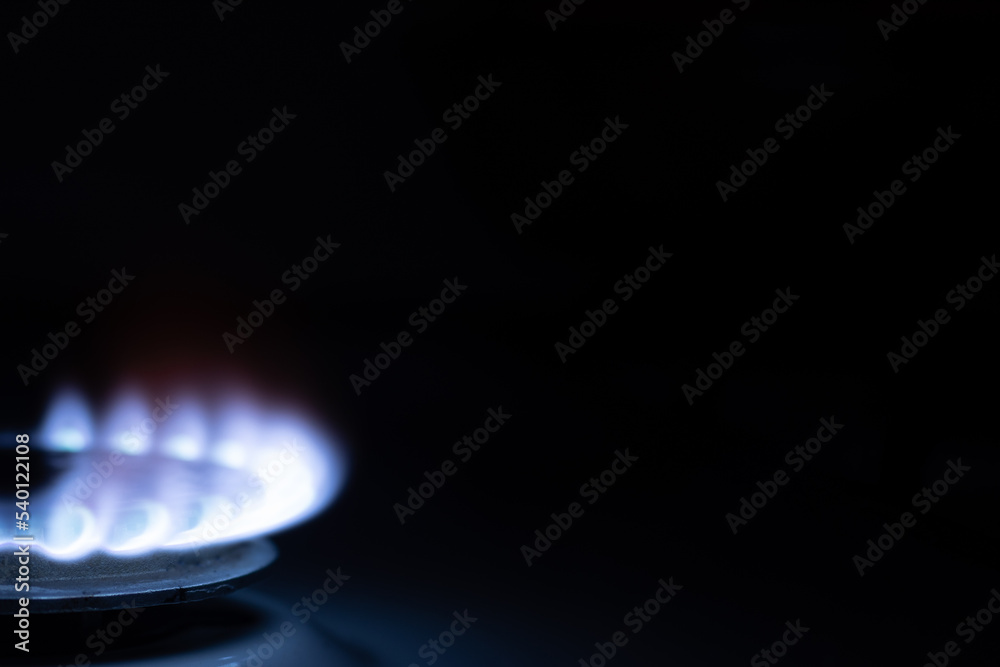 Gas burns with blue flames. Gas crisis around the world. Selective focus on the flame. Soft focus on the picture. Natural gas for housing