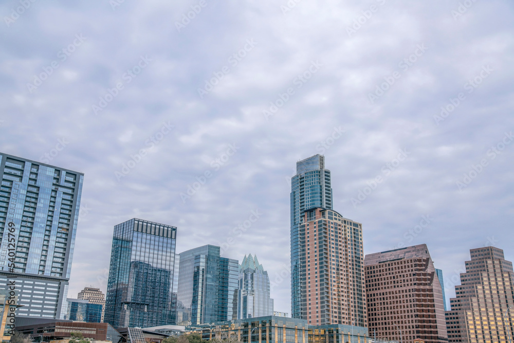 Downtown Austin Texas skyline against a backdrop of sky covered with clouds