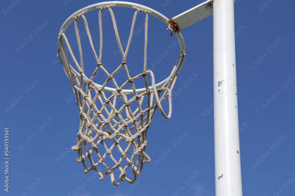 netball hoop against blue sky