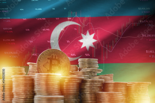 Azerbaijan flag and big amount of golden bitcoin coins and trading platform chart. Crypto currency photo