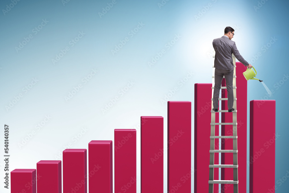 Businessman in investment growth concept with watering can Businessman in investment growth concept with watering can