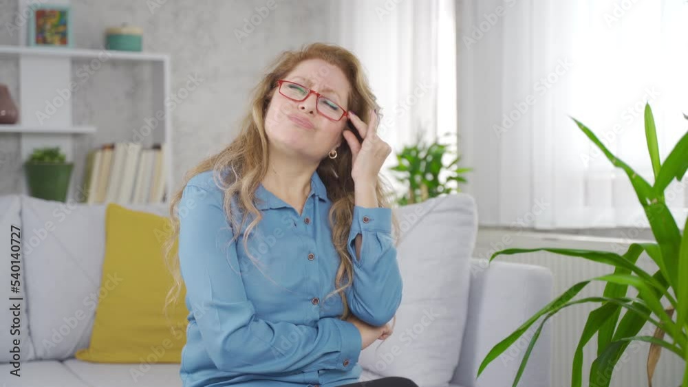 Mature woman has a headache.
Sick mature woman has a headache and rubs her head with her hands.
Mature woman has a headache.
Sick mature woman has a headache and rubs her head with her hands.