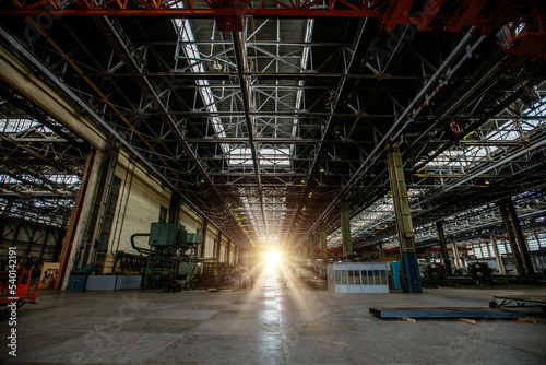 Heavy mechanical engineering factory production line. Interior of large worksop