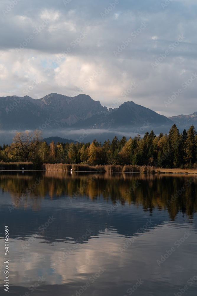 Mountain lake in autumn fall in the alps