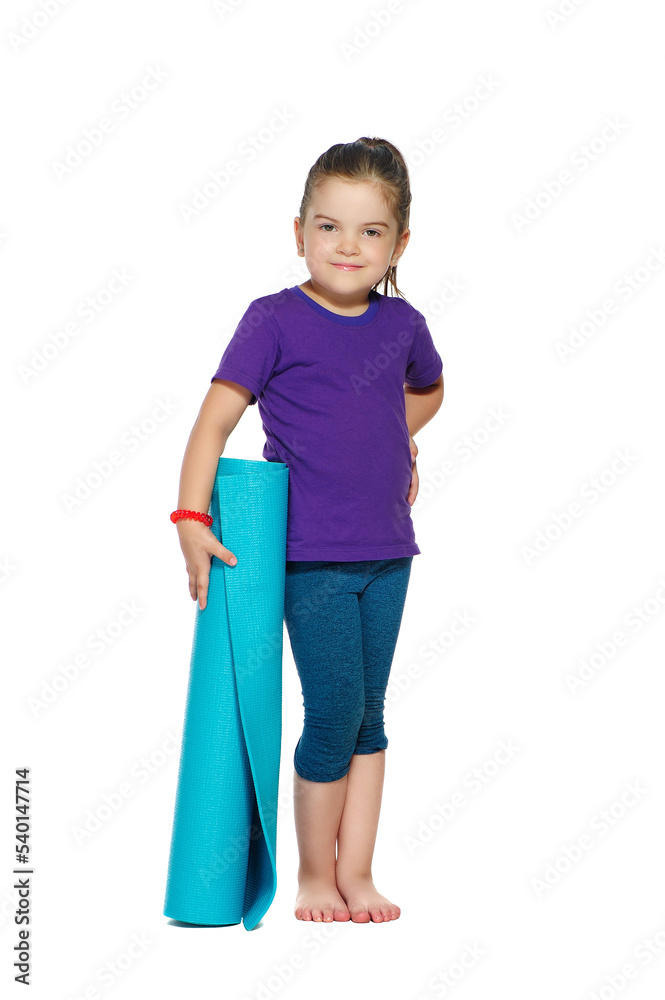 Little girl standing with yoga mat isolated on white Little girl standing with yoga mat isolated on white