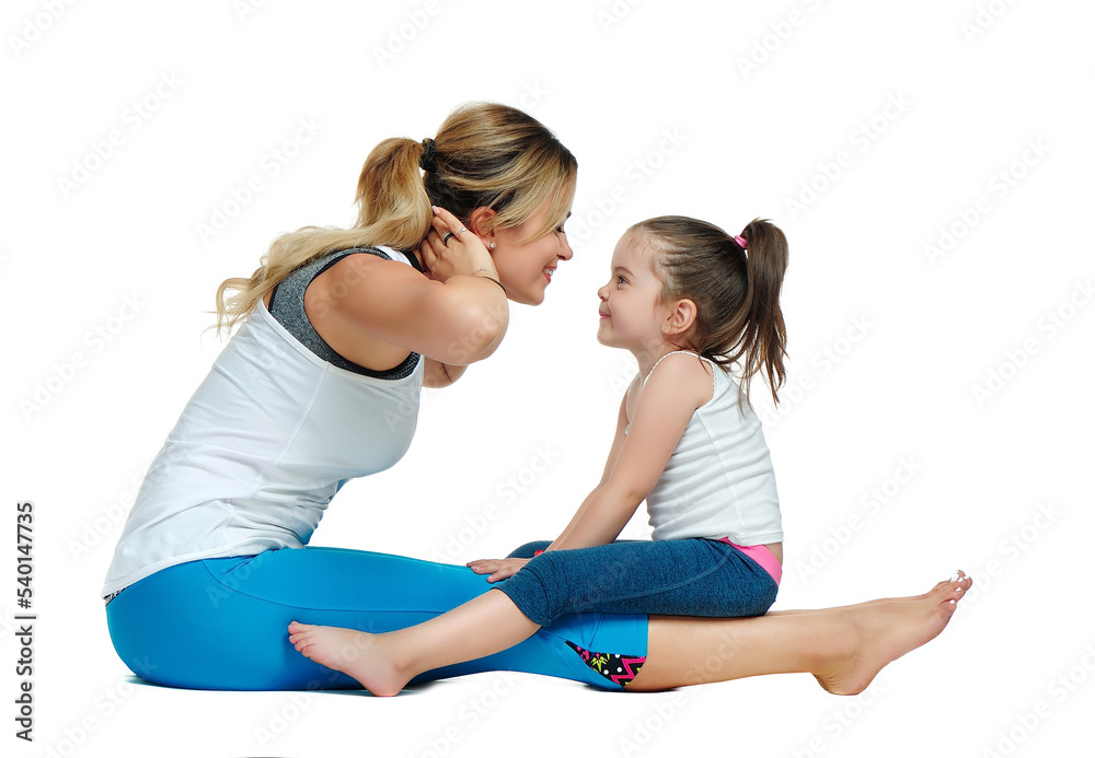Mother making exercises with her little daughter Mother making exercises with her little daughter