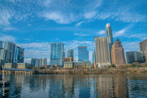 Austin Texas urban landscape with buildings along the calm Colorado River © Jason