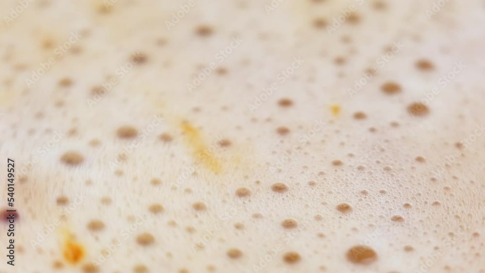 Coffee foam close-up. Stirring coffee drink. Macro video of coffee bubbles. Coffee foam close-up. Stirring coffee drink. Macro video of coffee bubbles.