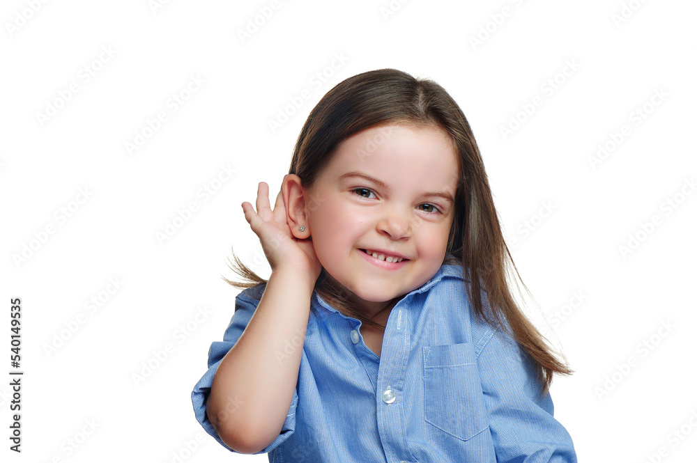 Preschool girl holding her hand next to the ear Preschool girl holding her hand next to the ear