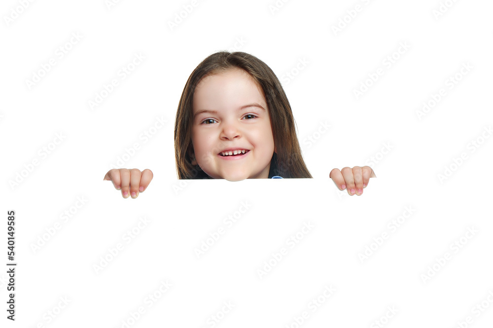 Smiling little girl with a blank board isolated on white Smiling little girl with a blank board isolated on white