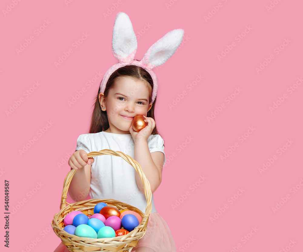 Smiling little girl with Easter eggs in her hand