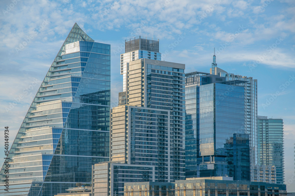Fototapeta premium Shiny glass buildings in the Austin Texas skyline against blue sky and clouds