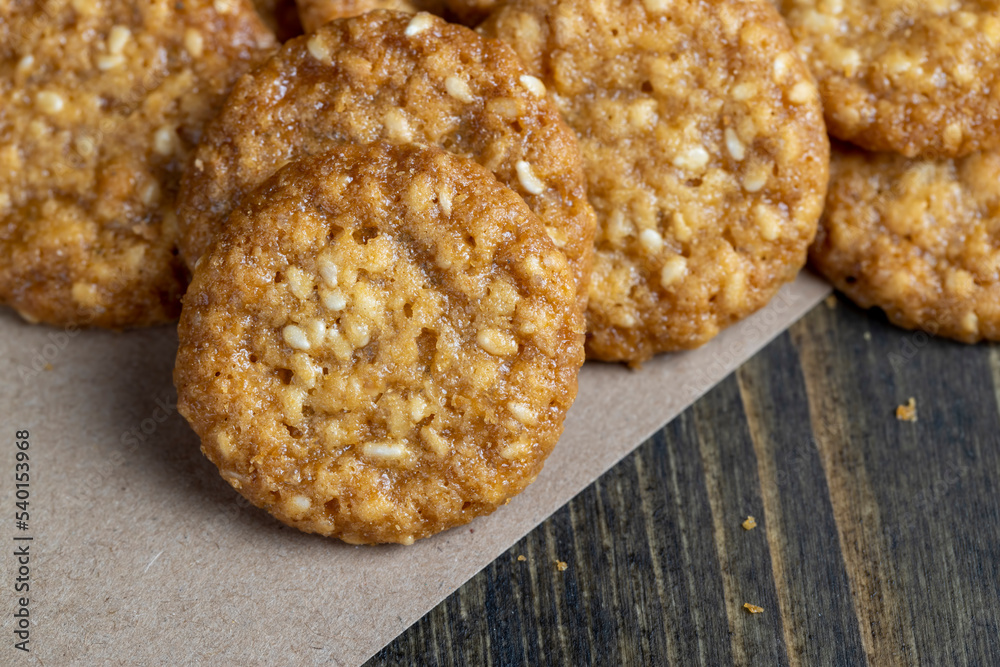 oatmeal thin round cookies with lots of sesame seeds oatmeal thin round cookies with lots of sesame seeds