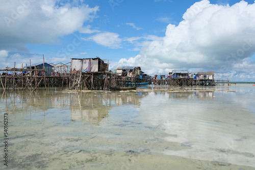 Omadal Island is a Malaysian island located in the Celebes Sea on the state of Sabah. The bajau laut village community during low tide time. photo