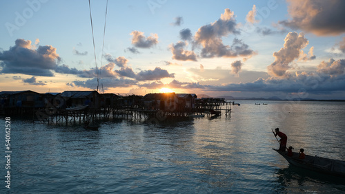 Beautiful sunset time at a bajau village, Pulau Omadal. photo