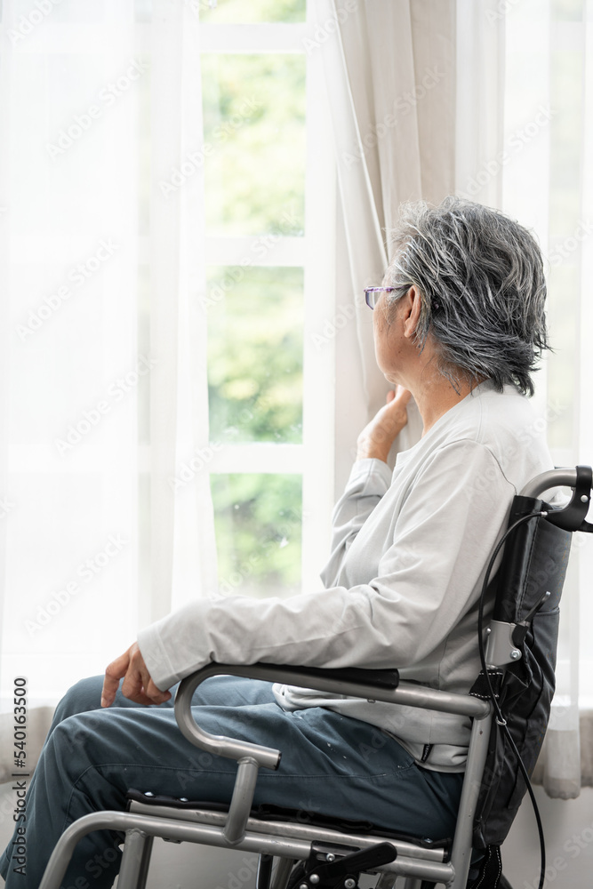 Female senior sit in wheelchair look in distance feel lonely, thoughtful sad handicapped mature woman in wheel chair thinking. Person with a disability. suffering from loneliness, thinking of future. Female senior sit in wheelchair look in distance feel lonely, thoughtful sad handicapped mature woman in wheel chair thinking. Person with a disability. suffering from loneliness, thinking of future.