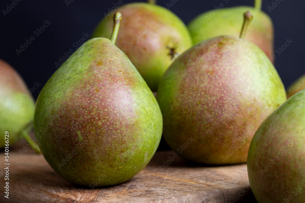 washed ripe green pears on the cutting board washed ripe green pears on the cutting board