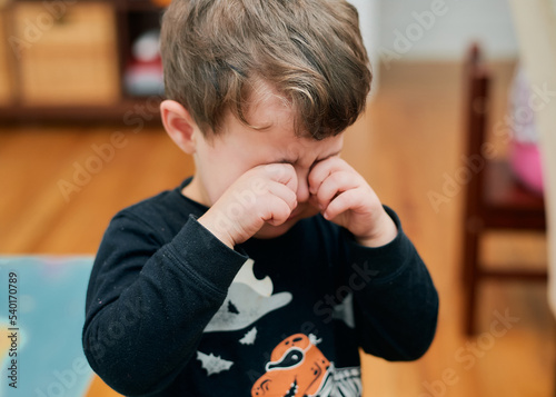 Upset young boy is crying and whining