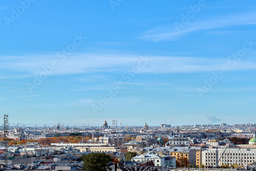 Rooftops of a European city on an autumn day. Cityscape taken from the observation deck. Roofs of houses and buildings  domes of churches and cathedrals taken from a great height.