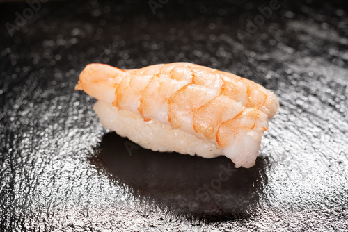 Ebi sushi, Japanese shrimp on Japanese rice. Nigiri ebi sushi. Japanese tradition food cuisine style with black background. photo