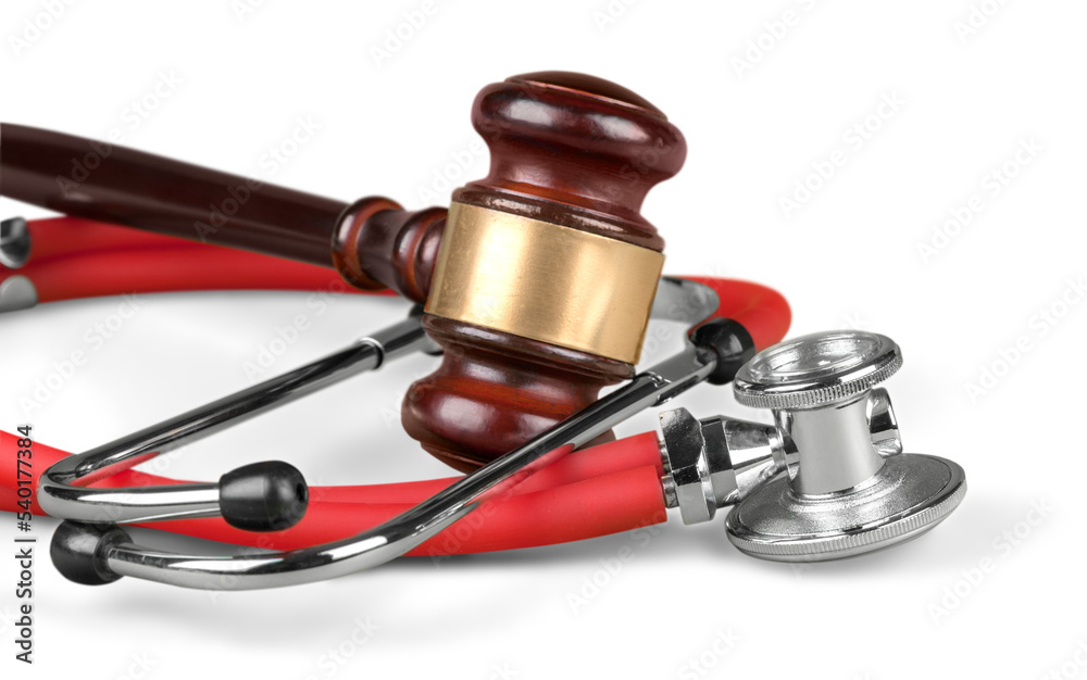 Gavel and stethoscope on background, symbol photo for bungling and medical error Gavel and stethoscope on background, symbol photo for bungling and medical error