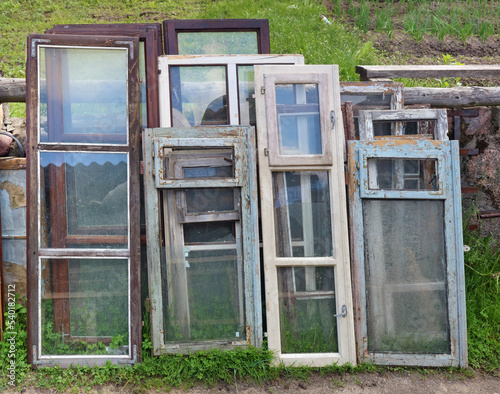Old wooden broken windows on village garbage dump